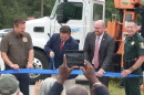 Florida Governor Ron DeSantis cuts the ribbon to denote completion of the State Road 777 (Rover Road) widening project in Sarasota County, Friday.