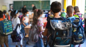 Students with face masks enter their classroom at the Petri primary school in Dortmund, western Germany, on Aug. 12, 2020, amid the COVID-19 pandemic. (Ina Fassbender/AFP via Getty Images)