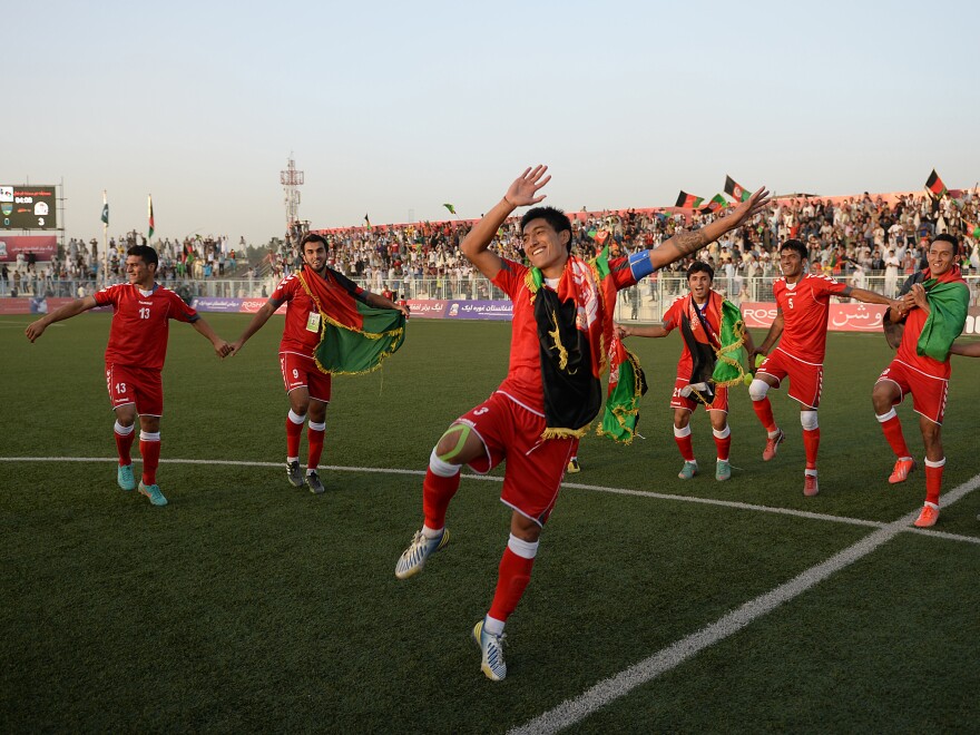 Afghan soccer players celebrate their 3-0 win against Pakistan on Aug. 20 in Kabul.