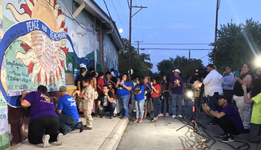 community gathered at the Peace and Remembrance mural