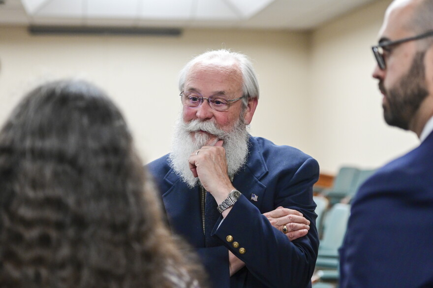 Latah County Prosecutor Bill Thompson speaks with Wendy Olson, left, and Cory Carone during a motion hearing regarding a gag order for a case against Bryan Kohberger in Latah County District Court, Friday, June 9, 2023, in Moscow, Idaho. Kohberger is accused of killing four University of Idaho students in November 2022. (Zach Wilkinson/The Moscow-Pullman Daily News via AP, Pool)