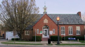The Mason Library, a medium-sized brick building on a streetside.