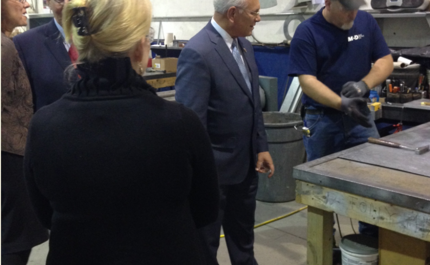 Officials observe employees at work at McD Metals LLC