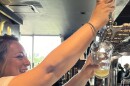 Alyson Vann serving Alamo Beer to thirsty customers at Alamo Beer Company