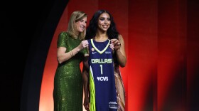 UConn guard Azzi Fudd poses with WNBA commissioner Cathy Engelbert after being selected first overall by the Dallas Wings in the first round of the WNBA basketball draft Monday, April 13, 2026, in New York.