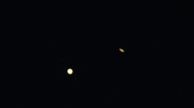 Planets Jupiter (left) and Saturn are seen during the Great Conjunction from the Griffith Observatory in Los Angeles.