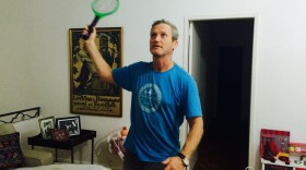James Hider, the reporter's husband, wields the zapping racket to kill some pesky mosquitoes at their home in Rio de Janeiro, Brazil.