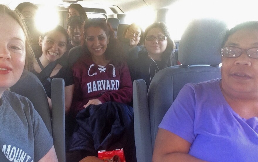 University of Florida staff members and students pose in a van on their way to Washington D.C. to document reactions and stories at Friday's inauguration of President-elect Donald Trump and Saturday's Women's March on Washington. (Photo courtesy Aliya Miranda)