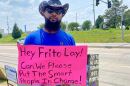  20 year Frito Lay veteran Chris Ware protests outside the plant in Topeka