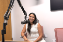 Dr. Javiera Monardez Popelka sitting behind a microphone in the WGLT studios.