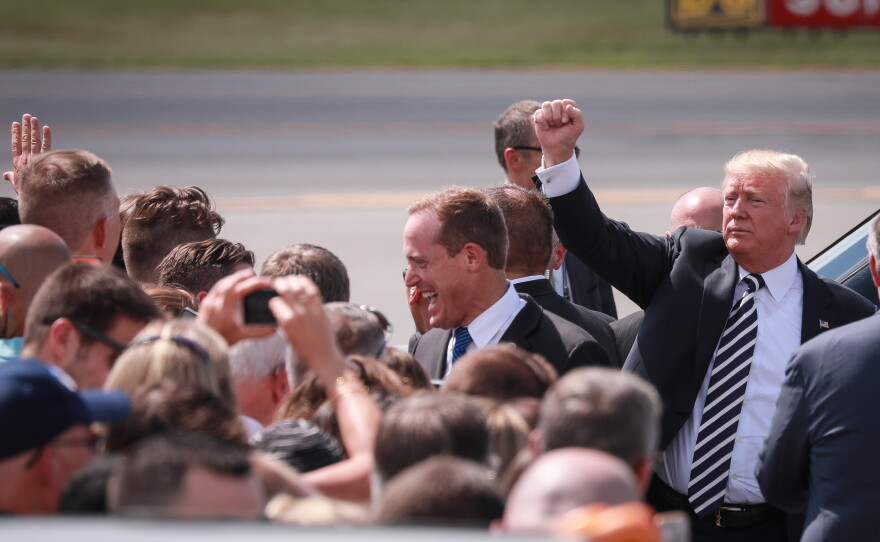 President Trump gestured to a crowd of supporters at Charlotte Douglas International Airport Friday, Aug. 31, 2018