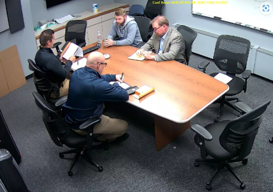 KCK police Officer Austin Schuler (upper left) being interviewed by KCPD detectives after the shooting of Amaree’ya Henderson. Schuler's lawyer is to his left.
