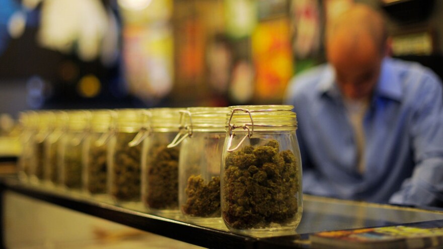 <p>Jars full of medical marijuana are seen at a medical marijuana dispensary in Los Angeles. U.S. attorneys sent letters telling more than a dozen of the shops to shut down.</p>