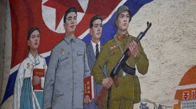 A propaganda painting is seen outside the People's Palace of Culture in Pyongyang, North Korea, in 2011. North Korean state media reported Friday that the nation has detained a U.S. tourist.