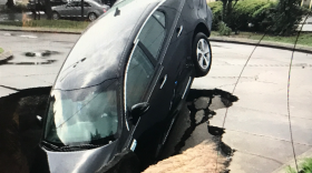 Closer photo of the car that fell into a sinkhole in Ocala (Brett Holcomb/WUFT)