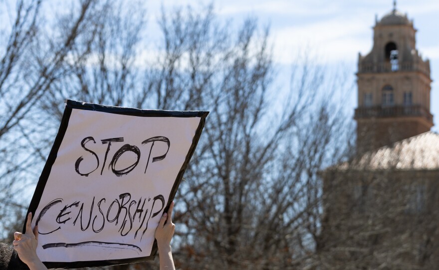 A stop censorship sign is held during the protest at Memorial Circle. 