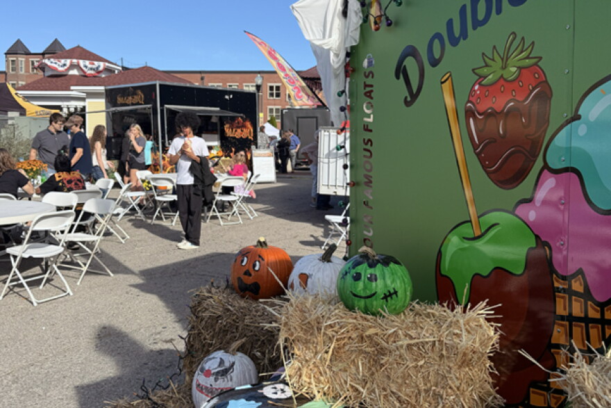 Painted pumpkins and hay bales sit in front of food vendor Double Dipped at the Orange County Pumpkin Festival Oct. 3. 