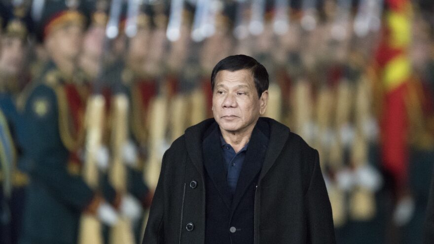 Philippine President Rodrigo Duterte reviews guards just outside Moscow late Monday. He announced Tuesday night he would be cutting his Russia visit short due to violence on Mindanao, where he declared martial law.