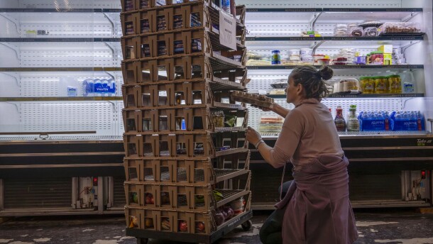 Volunteer Cindy Gevarter sorts through food items at the Storehouse New Mexico, a community-based food pantry in Albuquerque, in this November file photo. New Mexico and other states have challenged a federal agency’s request for personal information of food assistance recipients.