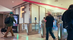 People walking through a security checkpoint on Airside F at Tampa International Airport.