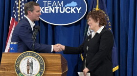 Gov. Andy Beshear shakes hands with incoming Kentucky poet laureate Kathleen Driskell on April 17, 2025.
