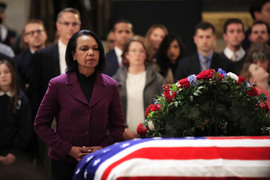 Former Secretary of State Condoleezza Rice pays her last respect to former President George H.W. Bush as he lies in state at the U.S. Capitol in Washington, Tuesday, Dec. 4, 2018. 