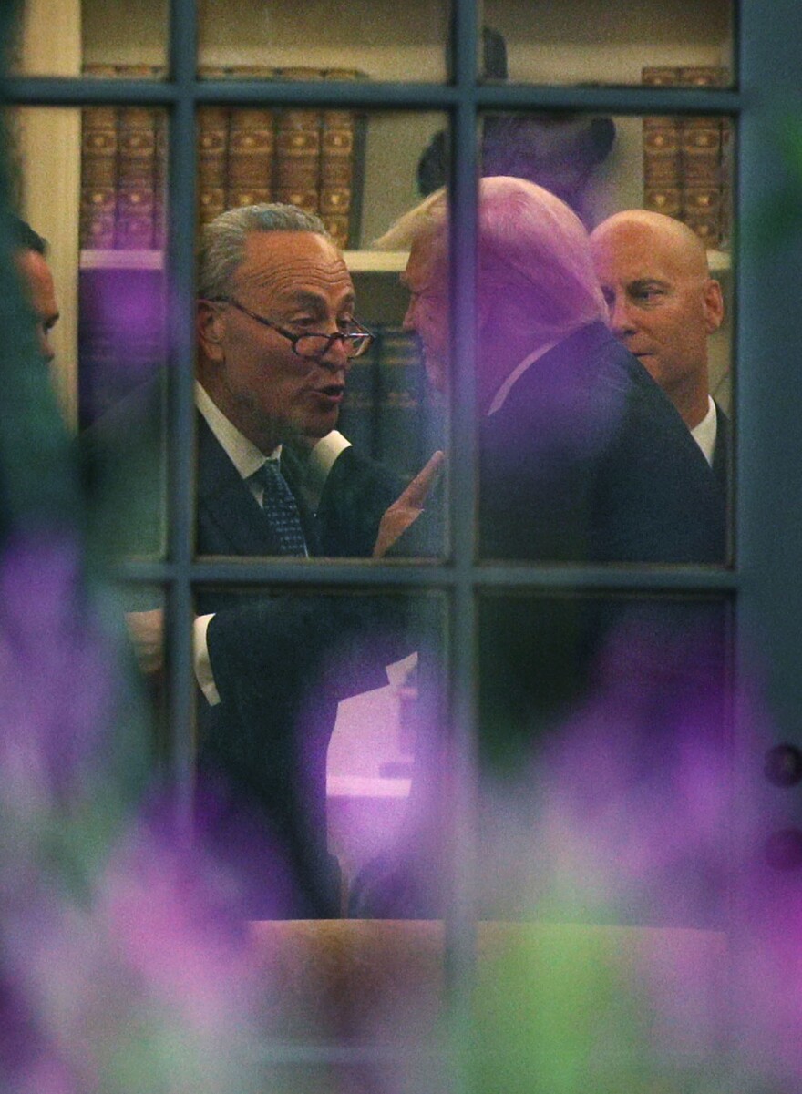 Senate Minority Leader Chuck Schumer, D-N.Y., makes a point to President Trump in the Oval Office after their White House meeting on Wednesday.