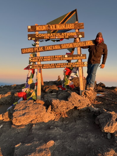 Clark Corbin at the summit of Mount Kilimanjaro.