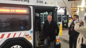 Akron Mayor Dan Horrigan departs a bus at the Robert K. Pfaff Transit Center. Mayor Horrigan rode Metro buses as part of the "Official-ly Onboard" event.
