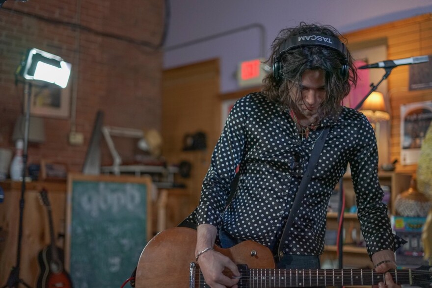 Izzy De Simone on guitar.