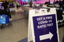 An international passenger arrives near a new rapid COVID-19 testing site for arriving international passengers at Los Angeles International Airport (LAX) on Friday in Los Angeles.