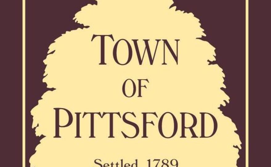 Beige illustration of a tree with "Town of Pittsford, Settled 1789" in brown text. 