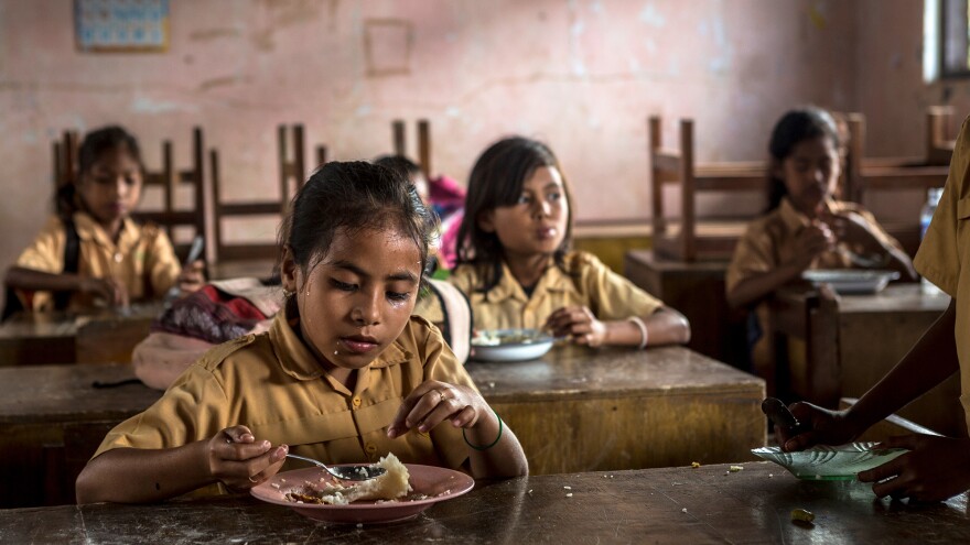 Schoolchildren in Sumba Island enjoy their weekly free meal from the Sumba Foundation, which reaches 3,000 students with its program.