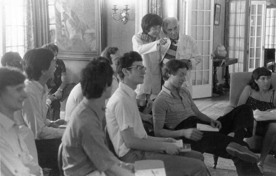 Seiji Ozawa (standing, left) and Leonard Bernstein join 1988 Tanglewood Music Center fellows at Seranak, the summer home of Tanglewood founder Serge Koussevitzky.