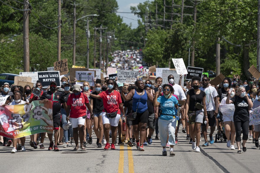 Several hundred protesters participate in Saturday's peace march in Kirkwood.