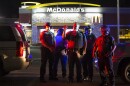 Ferguson police officers record protesters on W. Florissant Avenue on Aug. 9, 2016.