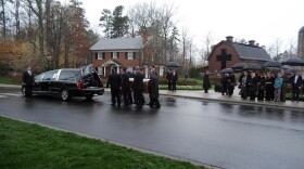 Pallbearers move Billy Graham's casket from a hearse to the Billy Graham Library on Thursday. 