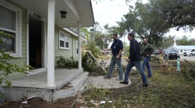 Florida Gov. Ron DeSantis, second right, visits a home that had its interior heavily damaged by storm surge during the passage of Hurricane Idalia on Aug. 31, 2023, in Horseshoe Beach, Fla.