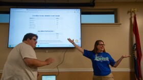 Sharon Jones, right, gestures to the election results screen after Aubrey Smith refreshed the website Tuesday at the LiUNA Local 955 building in Columbia. Jones won the Fourth Ward seat on the Columbia City Council on Tuesday. Jones is a civil rigts attorney and has been practicing law for more than 20 years.