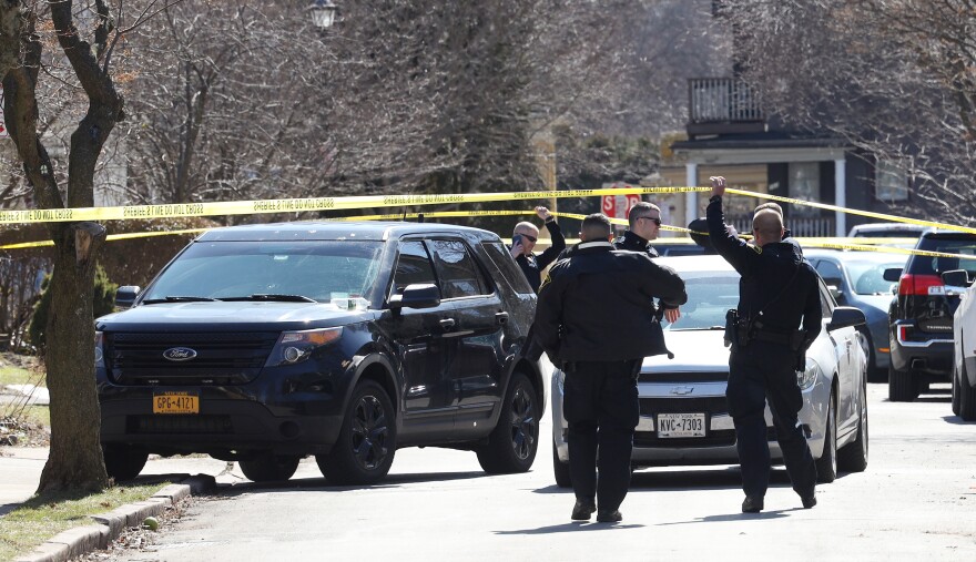 Multiple law enforcement agencies investigate two vehicles on Vassar Street near Park Avenue, that are connected to the officer involved shooting on Barrington Street where a man was killed when officers tried to apprehend him Monday, March 20, 2023. (photo by Max Schulte)