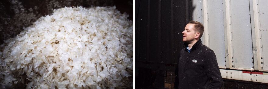 Garlic skins fall on operations manager Harald Vaernes (right) at the processing plant. The company had to pull garlic from storage to meet increased demand.