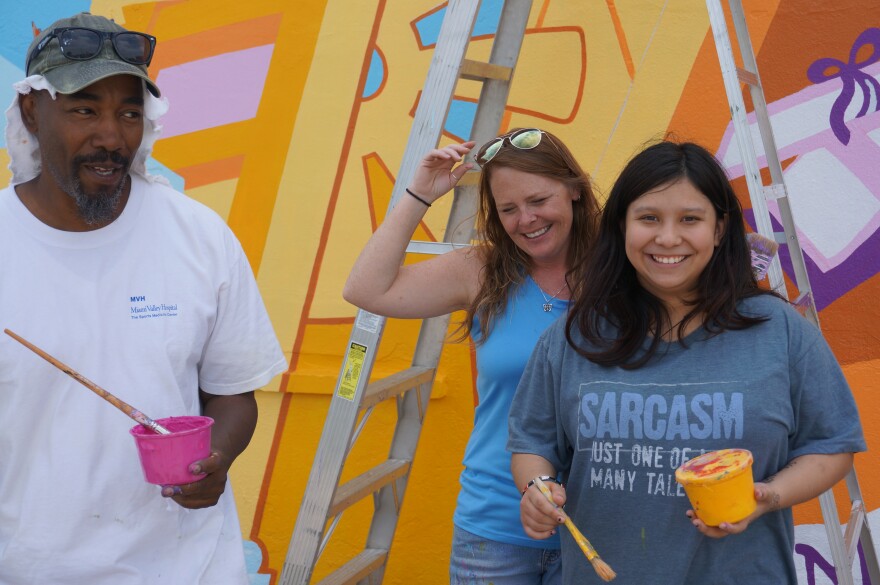 James Pate, Brittini Long, and Leo painting at the Wesley Community Center