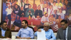 Members of the human rights organization Cristosal, from left, Rene Valiente, Noah Bullock, Abraham Abrego and Rafael Cruz, sit moments before giving their press conference 