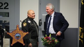 Cuyahoga County Sheriff Harold Pretel (left) speaks to County Executive Chris Ronayne (right) at a program commemorating the opening of a veterans' pod at the jail in Downtown Cleveland.