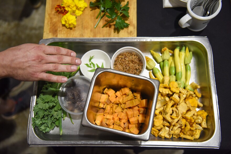 J.T. Gelineau(cq) lays out his ingredients for a savory plant-based meal on Monday, July 17, 2023, at Mushrooms Naturally in O’Falllon, Mo. In addition to microgreens, mushrooms and sweet potatoes, Gelineau uses miso, hot sauce and soy sauce — all produced from fungi.