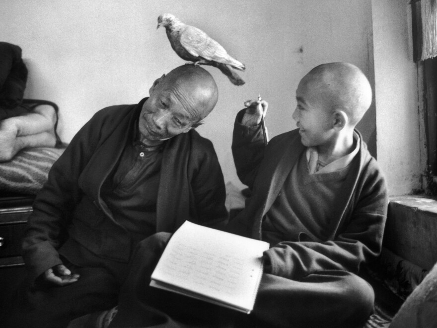 Tulku Khentrul Lodro Rabsel, 12, is pictured with his tutor Lhagyel at the Shechen Monastery in Bodnath, Nepal. Kehntrul entered the monastery at the age of 5, and like other young monks was restricted from seeing other monks of his age. Martine Franck took this photo in 1996.