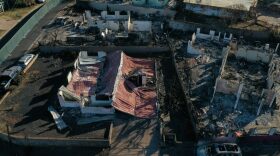 An aerial image shows destroyed homes and vehicles after a wind driven wildfire burned from the hills through neighborhoods to the Pacific Ocean, as seen in the aftermath of the Maui wildfires in Lahaina, Hawaii.