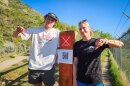 Hite Stromberg and Chloe Reynolds stand with a new “Stay off Golf Course” sign near the 29th Street Trailhead in Ogden, May 2, 2025.