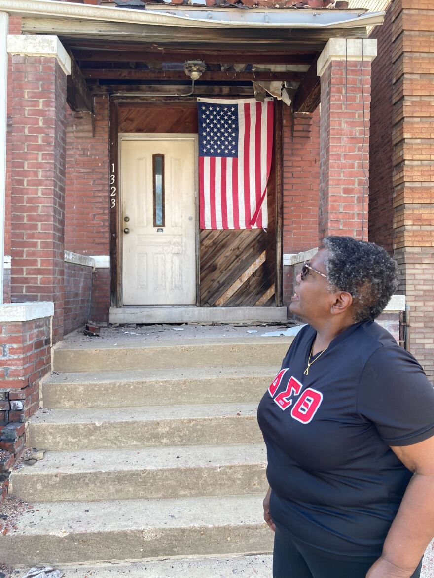 Margaret Williams stands in front of her house on Walton Avenue in the Fountain Park neighborhood of St. Louis on May 20. She and her husband, Melvin, have had an American flag hanging on their front stoop since 9/11.