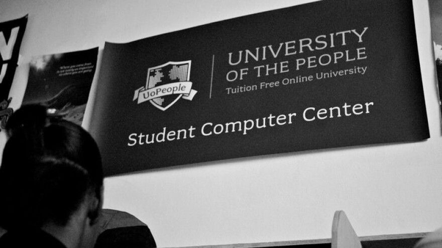 Students work at the University of the People student computer center in Haiti. Students from 129 countries are currently enrolled with the institution.